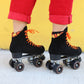 Chuffed Skates black roller skates  with yellow background